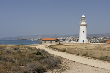 Cyprus Lighthouse Overlooking Coastal City.