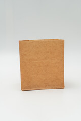 Brown paper bag on white background - 779697451
