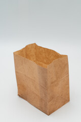 Brown paper bag on white background - 779697856