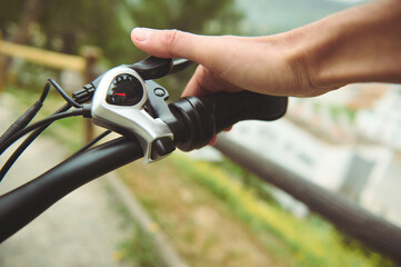Isolated bicycle brakes in male cyclist's hand. Adjusting bicycle hand brakes while riding cycling...