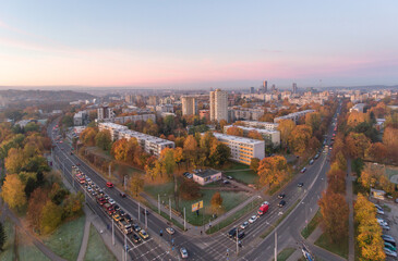 Zirmunai District in Vilnius City, Lithuania. Morning Traffic. Autumn Leaves Color. Morning Golden Hour Light.