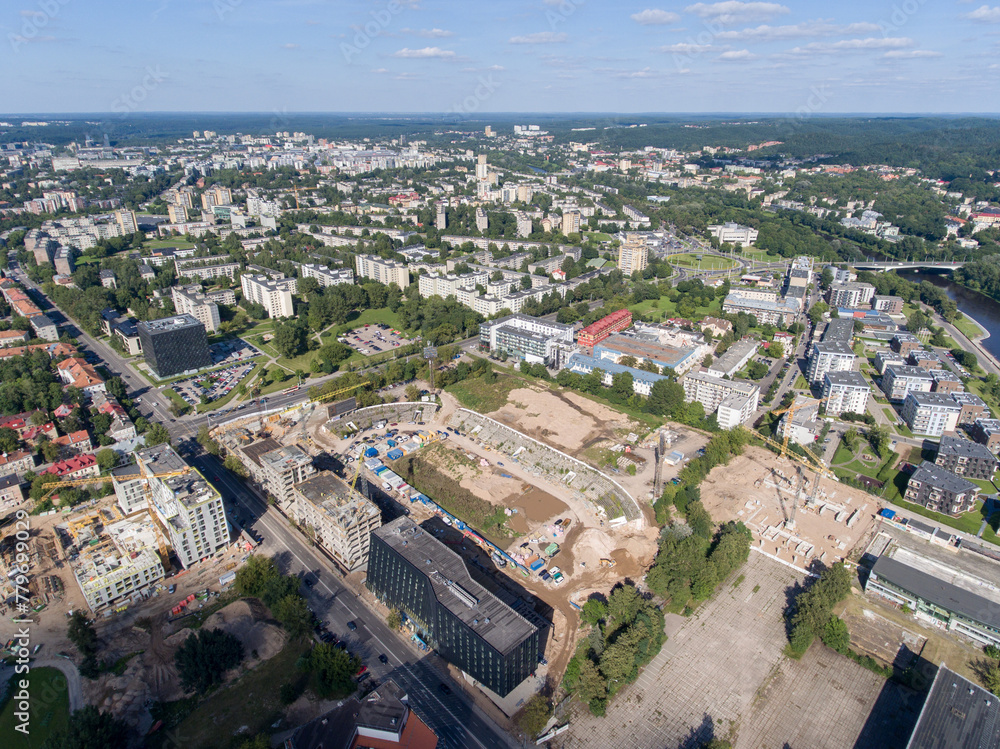 Wall mural vilnius city cityscape, lithuania. snipiskes zirmunai district, business town in background. drone p