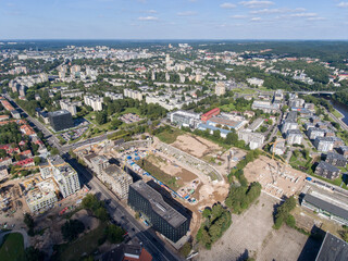 Obraz premium Vilnius City Cityscape, Lithuania. Snipiskes Zirmunai District, Business Town in Background. Drone Point of View. Abandoned Zalgiris Stadium