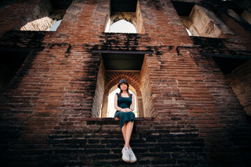 woman standing in front of wall