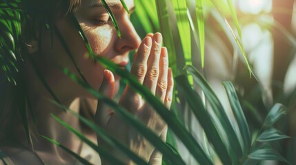 An image of a person praying with a palm branch in their hands, reflecting the spiritual significance of the day