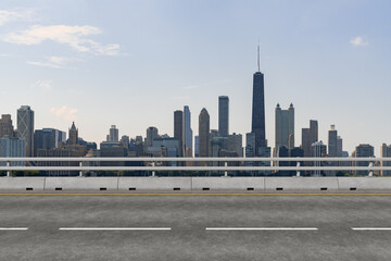 Naklejka premium Empty urban asphalt road exterior with city buildings background. New modern highway concrete construction. Concept of way to success. Transportation logistic industry fast delivery. Chicago. USA.
