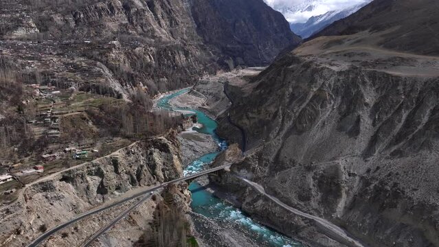 Karakoram Highway along Indus River in Hunza Valley, Pakistan. Gilgit-Baltistan, Himalayas Mountains, Aerial Drone Shot