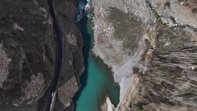 Karakoram Highway along Indus River in Hunza Valley, Pakistan. Gilgit-Baltistan, Himalayas Mountains, Aerial Drone Shot