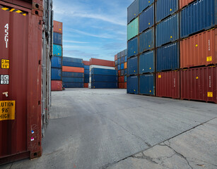 Fototapeta premium Business Logistics concept, Forklift truck handling cargo shipping white container box in logistic shipping yard..