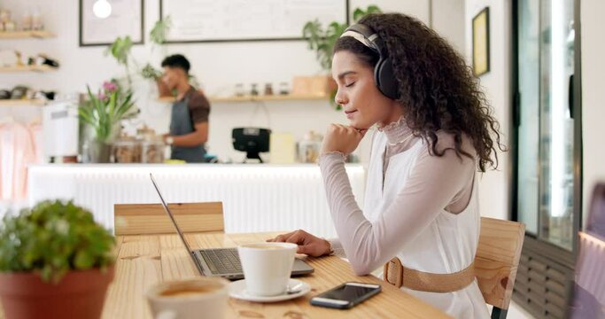 Coffee shop, remote work and woman on laptop and headphones for research, website and internet. Freelancer, business and person with cappuccino drink in restaurant working online and typing email