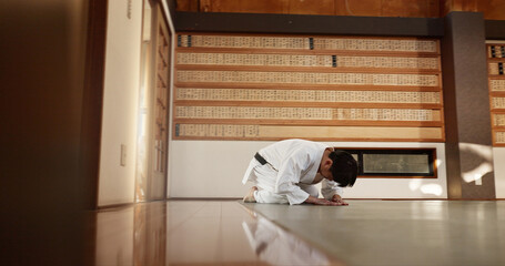 Japanese student, bow or man in dojo to start aikido practice, discipline or self defense...