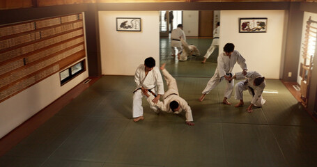 Japanese men, aikido class or training in fight, modern martial arts or learning self defence....