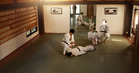 Japanese men, training and aikido fighting, modern martial arts and learning self defence. Respect,...
