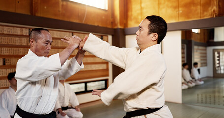 Japanese master, black belt student and learning martial arts in dojo place in fight and aikido...