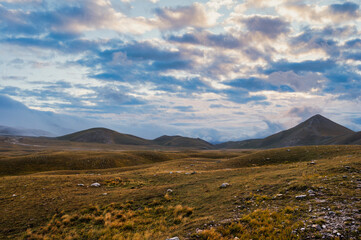 Fototapeta premium mountain landscape inside the National Park of Gran Sasso and Monti della Laga during an autumnal and cloudy morning, L'Aquila, Italy 