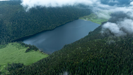 Aerial view of beautiful high altitude forest lake mountain landscape