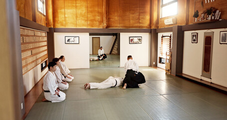 Students, aikido sensei or teaching Japanese martial arts in dojo for practice, body movement or...