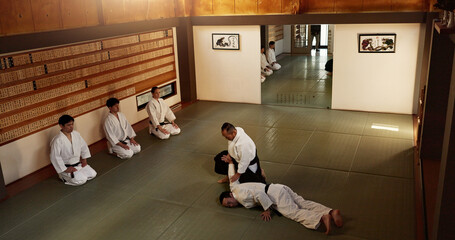 Japanese master, student or teaching of martial arts in dojo place, block or fighting in aikido...