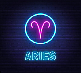 Neon Aries Sign on brick wall background.