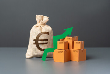 Boxes with a green arrow up near a euro money bag. High demand for goods. Import and export....