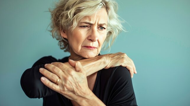 A woman caught in a moment of elbow pain, her posture and expression conveying the reality of living with arthritis - Powered by Adobe