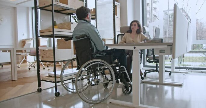 Business coworkers engaging in a brainstorming session in a bright, contemporary office space, portraying teamwork and strategy.