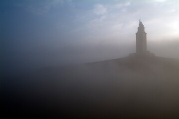 The tower of Hercules (A Coruña. Spain) in the middle of the fog. Only lighthouse with Roman...