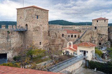 The Heptapyrgion or Yedikule (Seven Towers), a former fortress, later a prison and now a museum in Thessaloniki, Greece. Panoramic view of the walls and the church of the prison. - 779763685