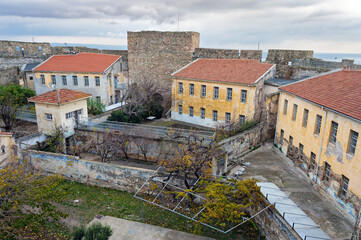 The Heptapyrgion or Yedikule (Seven Towers), a former fortress, later a prison and now a museum in Thessaloniki, Greece. Panoramic view of the buildings of the prison and part of the walls. - 779764693