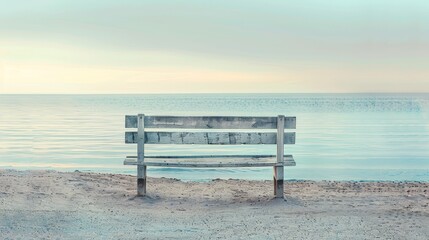 Naklejka na ściany i meble Vintage wooden bench by the sea, on an empty beach, under the serene sea light of early morning, perfect for tranquil product displays