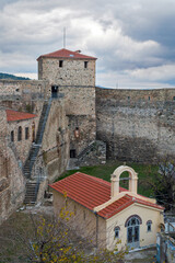 The Heptapyrgion or Yedikule (Seven Towers), a former fortress, later a prison and now a museum in Thessaloniki, Greece. View of the church of the prison and part of the walls. - 779765029