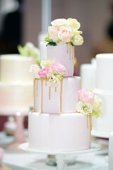 Wedding cake decoration with colorful flowers, it is served at wedding receptions. Vintage style for weddings, birthdays.
