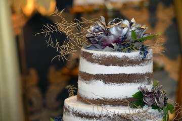 Wedding cake decoration with colorful flowers, it is served at wedding receptions. Vintage style...