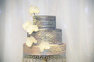 Wedding cake decoration with colorful flowers, it is served at wedding receptions. Vintage style...