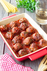Meatballs in tomato sauce with herbs. Paste. Italian Cuisine.
