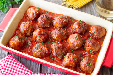 Meatballs in tomato sauce with herbs. Paste. Italian Cuisine.
