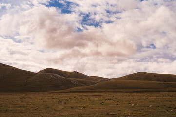 mountain landscape inside the National Parl of Gran Sasso and Monti della Laga during an autumnal and cloudy morning, L'Aquila, Italy     