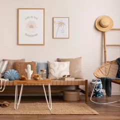 Türaufkleber Sunny and bright space of living room with stylish sofa, pillows, coffee table, mock up poster frames, decorations, furnitures and personal accessories. Cozy home decor. Template. Summer vibe. © FollowTheFlow
