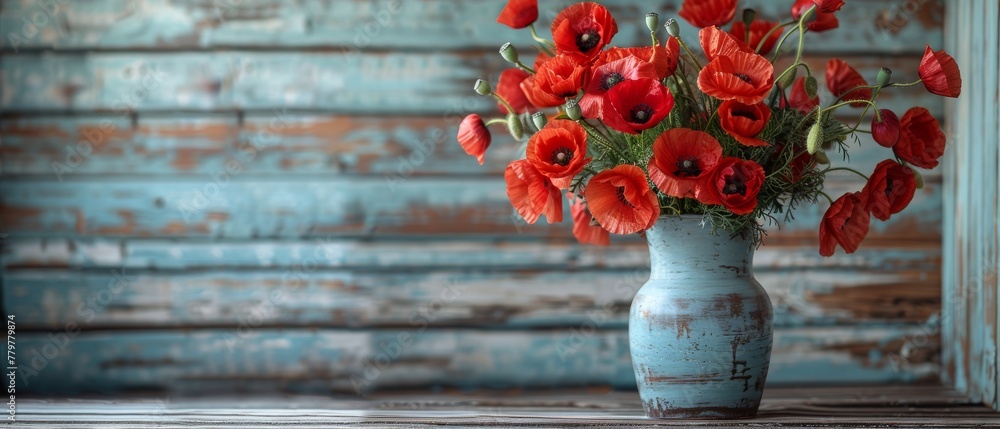 Poster a red poppies bouquet with a motivational frame for the text is displayed on a white wooden plank ba