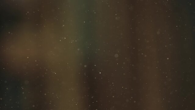 Extreme close up shot of wooden dust after sawing wooden planks or boards floating in the air, cinematic abstract background.