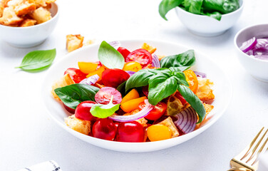 Summer italian salad with stale bread, tomatoes, red onion, olive oil, salt and green basil, white table background, top view - 779782001