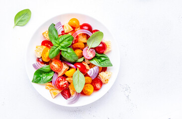 Summer italian salad with stale bread, tomatoes, red onion, olive oil, salt and green basil, white table background, top view - 779782005