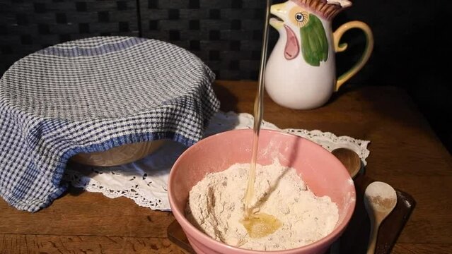 Breaking  egg into flour  baking  