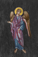 Christian traditional image of Angel . Religious illustration on black stone wall background in Byzantine style - 779785606
