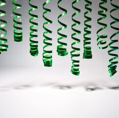 decorative green spiral ribbon on grey background