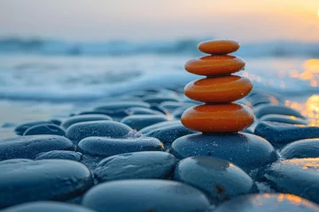 Poster Stenen in het zand A harmonious pile of balanced stones in the foreground against a soft sunset and calm ocean, evoking tranquility and balance