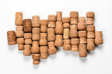 Beautiful champagne corks and wine on white background.