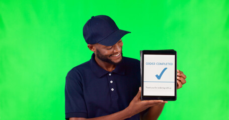 Tablet, delivery and complete with a black man on a green screen background in studio for distribution. Technology, supply chain logistics and order with a young male courier on chromakey mockup - Powered by Adobe