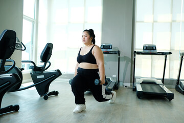 Chubby woman losing weight Plump woman exercising health care.