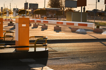 Automatic barrier gates for supermarket parking lot. Security system for car park entry to shopping...